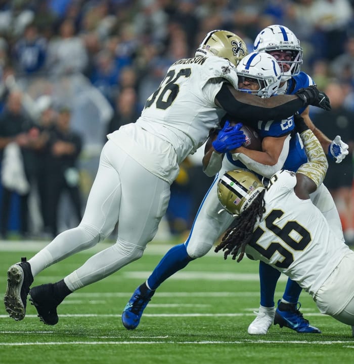 Oct. 29, 2023; New Orleans Saints defensive end Carl Granderson (96) and linebacker Demario Davis (56) tackle Indianapolis Colts running back Jonathan Taylor (28). © Jenna Watson/IndyStar / USA TODAY NETWORK